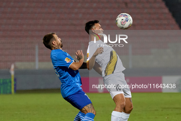 Ariel Brian Gambarte of Zabbar St. Patrick is closely challenged by Jose Ulisses Arias of Marsaxlokk during the Malta 360 Sports Premier Lea...