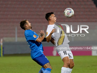 Ariel Brian Gambarte of Zabbar St. Patrick is closely challenged by Jose Ulisses Arias of Marsaxlokk during the Malta 360 Sports Premier Lea...