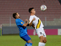 Ariel Brian Gambarte of Zabbar St. Patrick is closely challenged by Jose Ulisses Arias of Marsaxlokk during the Malta 360 Sports Premier Lea...