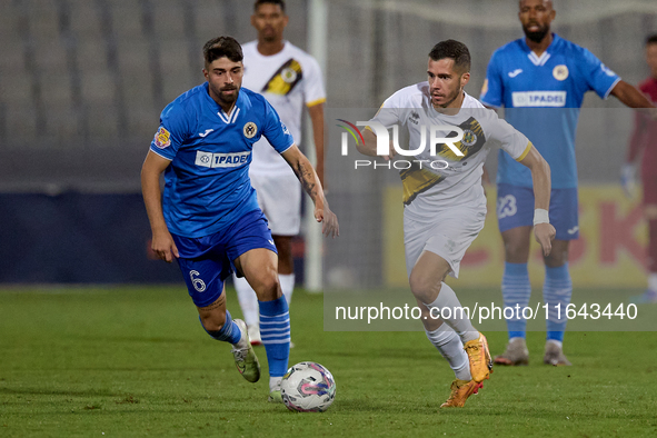 Stefan Ilic of Zabbar St. Patrick moves with the ball while Nikolai Muscat of Marsaxlokk closely attends during the Malta 360 Sports Premier...