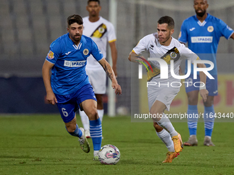 Stefan Ilic of Zabbar St. Patrick moves with the ball while Nikolai Muscat of Marsaxlokk closely attends during the Malta 360 Sports Premier...