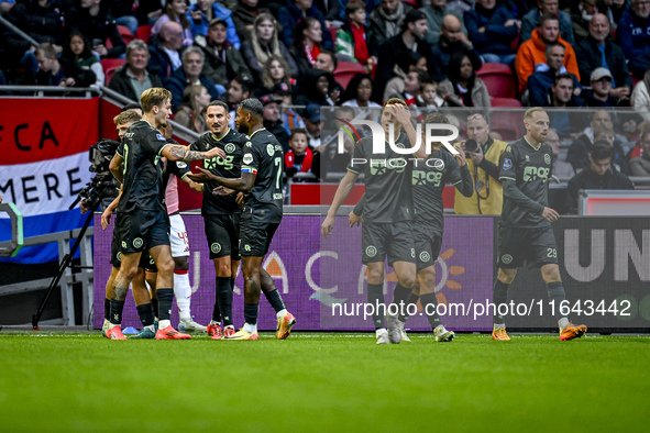 Players of FC Groningen celebrate the goal by FC Groningen midfielder Jorg Schreuders, making the score 1-1, during the match between Ajax a...