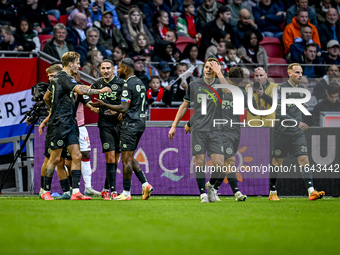 Players of FC Groningen celebrate the goal by FC Groningen midfielder Jorg Schreuders, making the score 1-1, during the match between Ajax a...