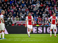 AFC Ajax Amsterdam midfielder Branco van den Boomen and AFC Ajax Amsterdam forward Mika Godts are disappointed after the goal by FC Groninge...