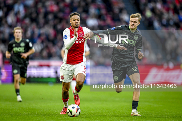 AFC Ajax Amsterdam defender Devyne Rensch and FC Groningen defender Finn Stam play during the match between Ajax and Groningen at the Johan...