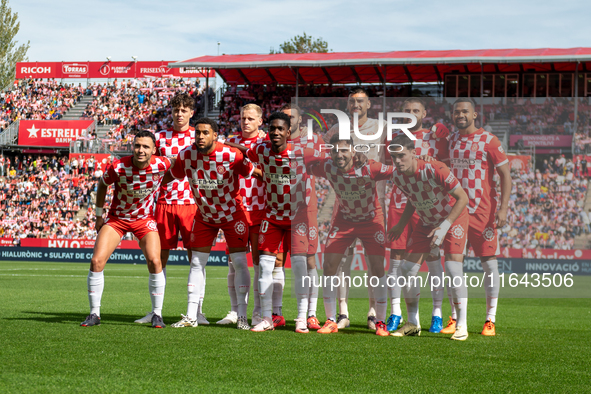 In Girona, Spain, on October 6, 2024, Girona FC players form during the LaLiga EA Sports match between Girona FC and Athletic Club de Bilbao...