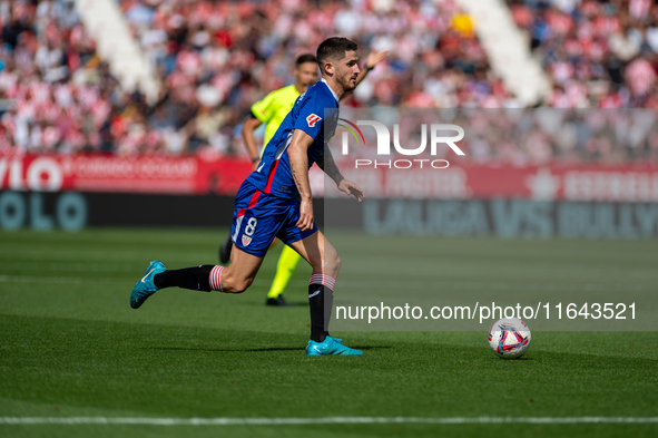 Players are in action during the LaLiga EA Sports match between Girona FC and Athletic Club de Bilbao at Montilivi Stadium in Girona, Spain,...