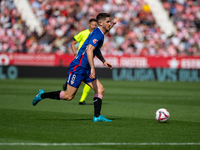 Players are in action during the LaLiga EA Sports match between Girona FC and Athletic Club de Bilbao at Montilivi Stadium in Girona, Spain,...