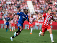 Inaki Williams of Athletic Club de Bilbao and Ladislav Krejci of Girona FC are in action during the LaLiga EA Sports match between Girona FC...