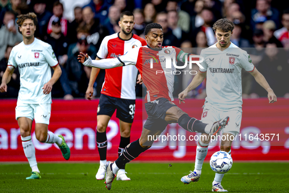 Feyenoord Rotterdam midfielder Quinten Timber and FC Twente midfielder Youri Regeer play during the match between Feyenoord and Twente at th...