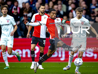 Feyenoord Rotterdam midfielder Quinten Timber and FC Twente midfielder Youri Regeer play during the match between Feyenoord and Twente at th...