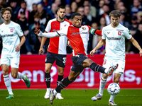 Feyenoord Rotterdam midfielder Quinten Timber and FC Twente midfielder Youri Regeer play during the match between Feyenoord and Twente at th...