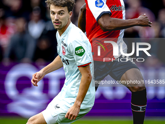 Feyenoord Rotterdam midfielder Antoni Milambo and FC Twente midfielder Youri Regeer play during the match between Feyenoord and Twente at th...