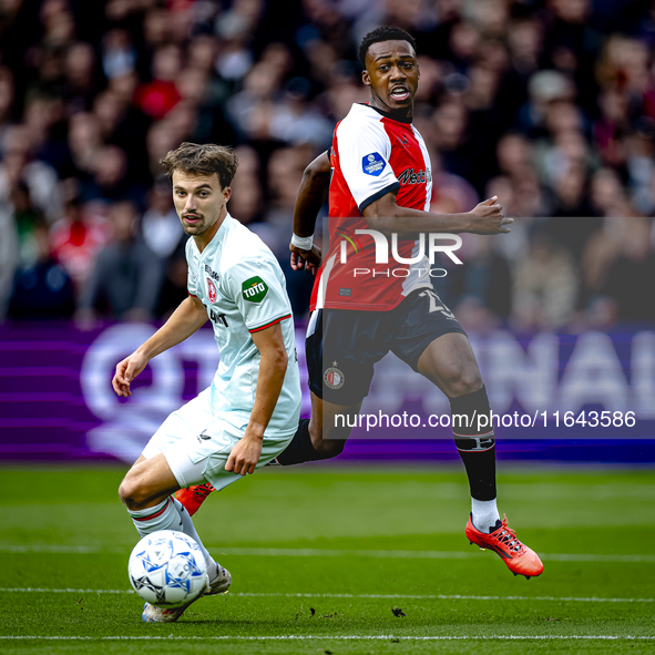 Feyenoord Rotterdam midfielder Antoni Milambo and FC Twente midfielder Youri Regeer play during the match between Feyenoord and Twente at th...