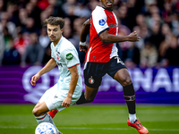 Feyenoord Rotterdam midfielder Antoni Milambo and FC Twente midfielder Youri Regeer play during the match between Feyenoord and Twente at th...