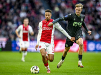 AFC Ajax Amsterdam defender Devyne Rensch and FC Groningen defender Finn Stam play during the match between Ajax and Groningen at the Johan...