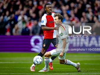 Feyenoord Rotterdam midfielder Antoni Milambo and FC Twente midfielder Youri Regeer play during the match between Feyenoord and Twente at th...