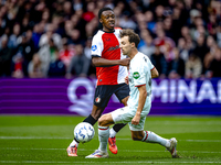 Feyenoord Rotterdam midfielder Antoni Milambo and FC Twente midfielder Youri Regeer play during the match between Feyenoord and Twente at th...