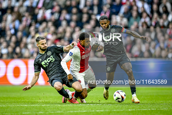 FC Groningen defender Marco Rente, AFC Ajax Amsterdam forward Chuba Akpom, and FC Groningen defender Leandro Bacuna participate during the m...