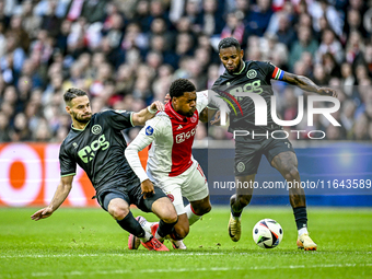 FC Groningen defender Marco Rente, AFC Ajax Amsterdam forward Chuba Akpom, and FC Groningen defender Leandro Bacuna participate during the m...