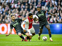 FC Groningen defender Marco Rente, AFC Ajax Amsterdam forward Chuba Akpom, and FC Groningen defender Leandro Bacuna participate during the m...