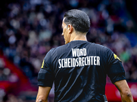 Referee Serdar Gozubuyuk wears a shirt with the word 'SCHEIDSRECHTER' during the match between Feyenoord and Twente at the Feyenoord stadium...