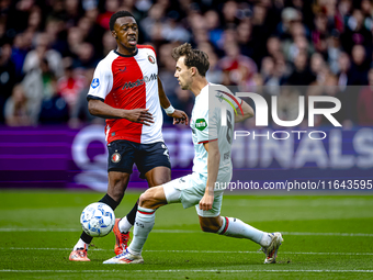 Feyenoord Rotterdam midfielder Antoni Milambo and FC Twente midfielder Youri Regeer play during the match between Feyenoord and Twente at th...