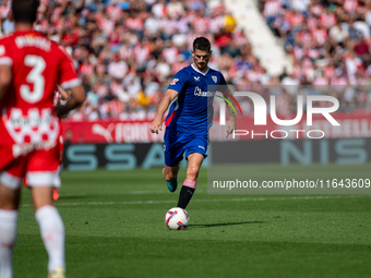 Players are in action during the LaLiga EA Sports match between Girona FC and Athletic Club de Bilbao at Montilivi Stadium in Girona, Spain,...