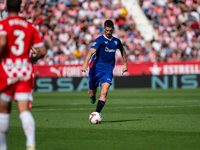 Players are in action during the LaLiga EA Sports match between Girona FC and Athletic Club de Bilbao at Montilivi Stadium in Girona, Spain,...