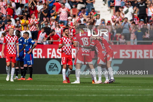 In Girona, Spain, on October 6, 2024, Girona players celebrate after scoring a goal during the LaLiga EA Sports match between Girona FC and...