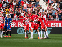 In Girona, Spain, on October 6, 2024, Girona players celebrate after scoring a goal during the LaLiga EA Sports match between Girona FC and...