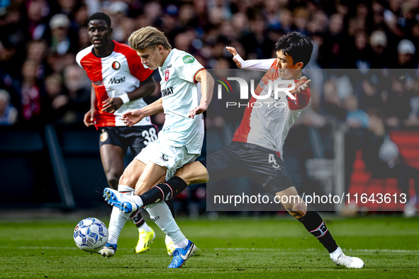 FC Twente midfielder Sem Steijn and Feyenoord Rotterdam midfielder Inbeom Hwang play during the match between Feyenoord and Twente at the Fe...