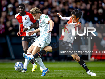 FC Twente midfielder Sem Steijn and Feyenoord Rotterdam midfielder Inbeom Hwang play during the match between Feyenoord and Twente at the Fe...