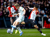 FC Twente midfielder Sem Steijn and Feyenoord Rotterdam midfielder Inbeom Hwang play during the match between Feyenoord and Twente at the Fe...