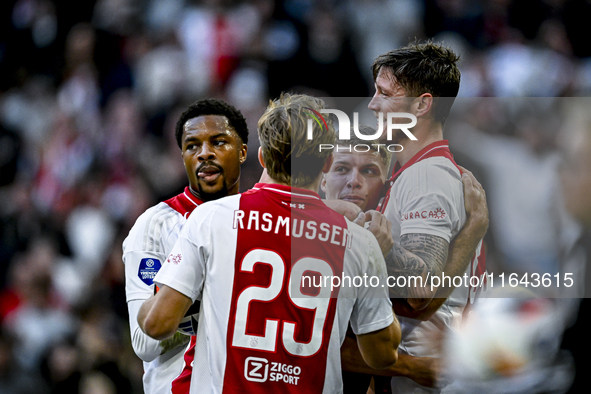 AFC Ajax Amsterdam forward Chuba Akpom, forward Christian Rasmussen, and defender Anton Gaaei celebrate the goal by forward Wout Weghorst, m...