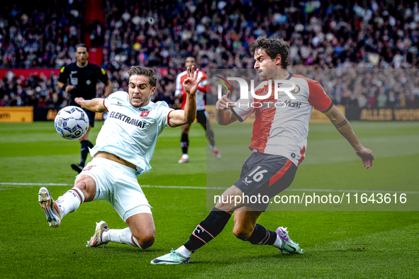 FC Twente defender Bart van Rooij and Feyenoord Rotterdam defender Hugo Bueno play during the match between Feyenoord and Twente at the Feye...