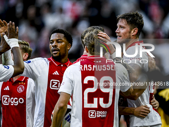 AFC Ajax Amsterdam forward Chuba Akpom, forward Christian Rasmussen, and defender Anton Gaaei celebrate the goal by forward Wout Weghorst, m...