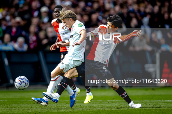 FC Twente midfielder Sem Steijn and Feyenoord Rotterdam midfielder Inbeom Hwang play during the match between Feyenoord and Twente at the Fe...