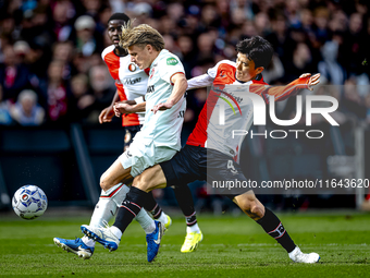 FC Twente midfielder Sem Steijn and Feyenoord Rotterdam midfielder Inbeom Hwang play during the match between Feyenoord and Twente at the Fe...