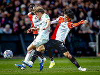 FC Twente midfielder Sem Steijn and Feyenoord Rotterdam midfielder Inbeom Hwang play during the match between Feyenoord and Twente at the Fe...