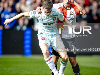 FC Twente forward Daan Rots and Feyenoord Rotterdam defender Hugo Bueno play during the match between Feyenoord and Twente at the Feyenoord...