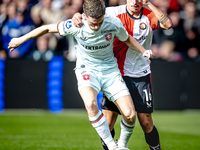 FC Twente forward Daan Rots and Feyenoord Rotterdam defender Hugo Bueno play during the match between Feyenoord and Twente at the Feyenoord...