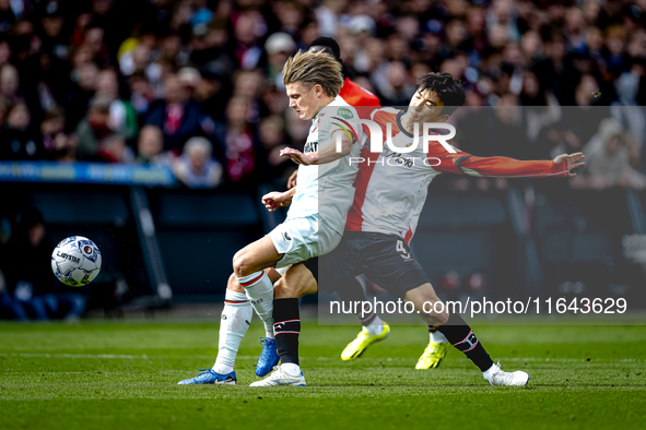 FC Twente midfielder Sem Steijn and Feyenoord Rotterdam midfielder Inbeom Hwang play during the match between Feyenoord and Twente at the Fe...