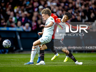 FC Twente midfielder Sem Steijn and Feyenoord Rotterdam midfielder Inbeom Hwang play during the match between Feyenoord and Twente at the Fe...