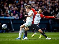 FC Twente midfielder Sem Steijn and Feyenoord Rotterdam midfielder Inbeom Hwang play during the match between Feyenoord and Twente at the Fe...