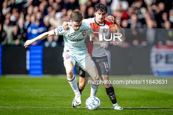 FC Twente forward Daan Rots and Feyenoord Rotterdam defender Hugo Bueno play during the match between Feyenoord and Twente at the Feyenoord...