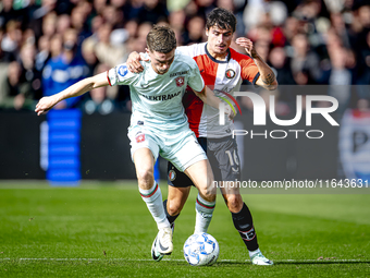 FC Twente forward Daan Rots and Feyenoord Rotterdam defender Hugo Bueno play during the match between Feyenoord and Twente at the Feyenoord...