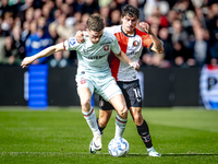 FC Twente forward Daan Rots and Feyenoord Rotterdam defender Hugo Bueno play during the match between Feyenoord and Twente at the Feyenoord...