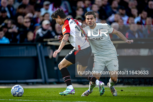 Feyenoord Rotterdam defender Hugo Bueno and FC Twente defender Bart van Rooij play during the match between Feyenoord and Twente at the Feye...