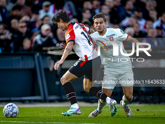 Feyenoord Rotterdam defender Hugo Bueno and FC Twente defender Bart van Rooij play during the match between Feyenoord and Twente at the Feye...